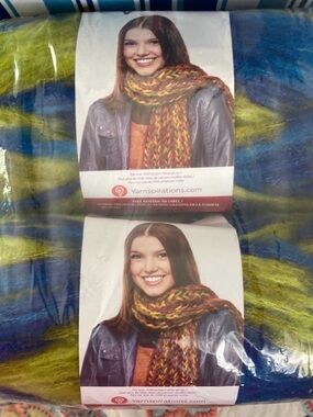 Bernat Yarn New 3.5 ounce each skeins of Caribbean (blues and green blend). 2